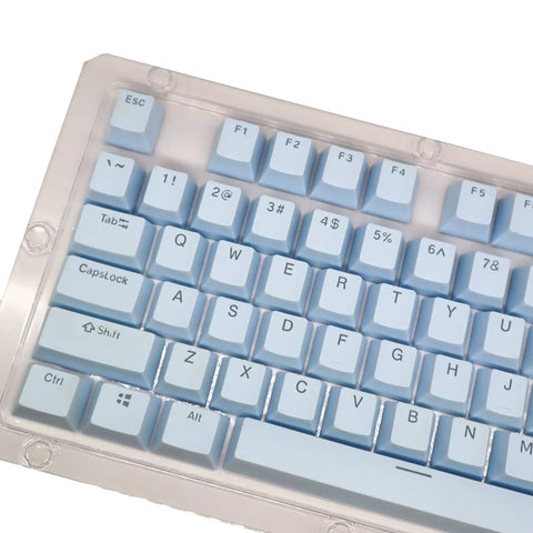 Premium PBT Keycaps With Dope Colorway And Ergonomic Arc Fit Smooth Typing Feel Hella Durable Oil Resistant Texture Perfect 108 Keys Layout For Gaming Rigs And Productivity Workstations In Light Blue Finish showing keys layout from an angle.