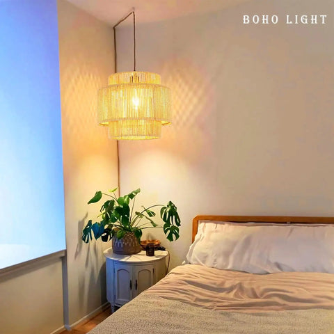 Handcrafted Rattan Plug In Pendant Light Featuring Smooth Dimmable Switch And Handwoven Wicker Bamboo Shade in cozy bedroom setting.