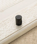 12 Pcs Cylindrical Cabinet Handles And Mini Drawer Pulls In Black For Cabinets Wardrobes Drawers And Jewelry Boxes 0.7 By 0.9 Inch Knobs Sturdy Zinc Alloy Construction Space Saving Hardware With Subtle Modern Minimalist Style on cabinet door