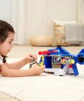 Child playing with Totally Rad Multicolor Micro Helicopter Toy 203307002 inside, featuring realistic rotor sound and smooth stabilization.