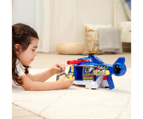 Child playing with Totally Rad Multicolor Micro Helicopter Toy 203307002 inside, featuring realistic rotor sound and smooth stabilization.