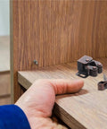 Cabinet installation with Double Roller Cabinet Door Catch Set Of 12 With Soft Cushion Spring Loaded Ball Latches on wooden surface.