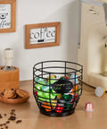 Large Capacity Black Wire Coffee Pod Holder With Wooden Base on kitchen counter next to coffee machine and snacks