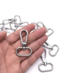 Heavy Duty Silver Swivel Lobster Clasps One Inch Metal Snap Hooks Built Boss Tough For Purses Bags And Secure Key Chains in hand.