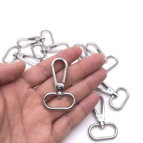 Heavy Duty Silver Swivel Lobster Clasps One Inch Metal Snap Hooks Built Boss Tough For Purses Bags And Secure Key Chains in hand.