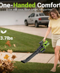 Person using Cordless Leaf Blower With 715 CFM Airflow And 200 MPH Wind, 35,000 RPM Brushless Motor, lightweight design, in yard