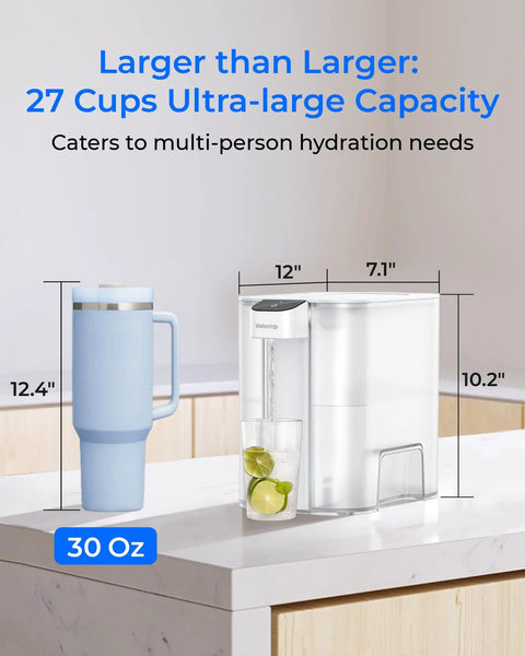 Mega Electric Water Filter Dispenser For Home Use, 27-Cup Capacity, beside a 30 oz blue tumbler on countertop