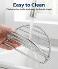 4 Piece Stainless Steel Taco Holder Stand Set With V Shaped Multi Layer Taco Rack being rinsed under a faucet in a sink