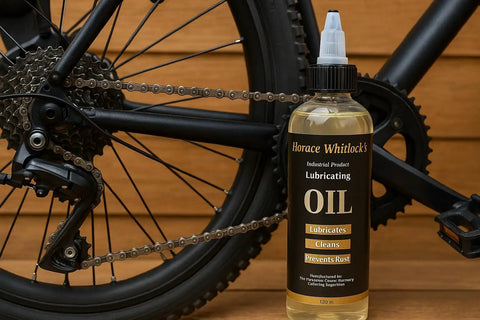 Bottle of Rugged Industrial Lubricating Oil For Tools And Machinery With Rust Prevention beside a bicycle chain