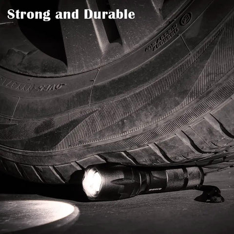 Two Pack High Lumen Led Flashlights For Home Camping And Travel Beast Bright Handheld Beams with tire demonstrating durability.