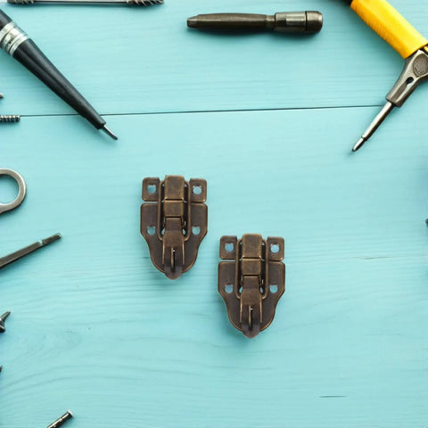 Retro Antique Duck Bill Toggle Latch 12 Pack With Hasp Catch For Jewelry Boxes And Suitcases showcasing two latches on a blue background.