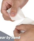 Person tearing Bulk 22 Roll White Duct Tape 660 Yards 2 Inch Heavy Duty No Residue All Weather Tear by Hand