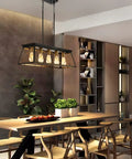 Dining room with Five Light Farmhouse Rectangular Pendant Chandelier For Dining Room And Kitchen Island, Black Rustic Metal Frame With Brass Gold Sockets, Adjustable Height Chain, E26 Base Bulbs Not Included, 31.5 Inch Long hanging above wooden table.