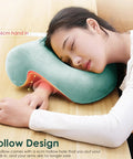 Woman using Donut Desk Nap Pillow Cushion With Velvet Fabric for face-down sleeping at desk, showing hollow design for arm insertion
