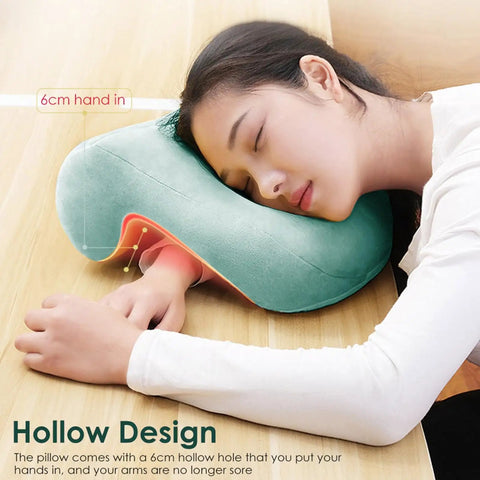 Woman using Donut Desk Nap Pillow Cushion With Velvet Fabric for face-down sleeping at desk, showing hollow design for arm insertion