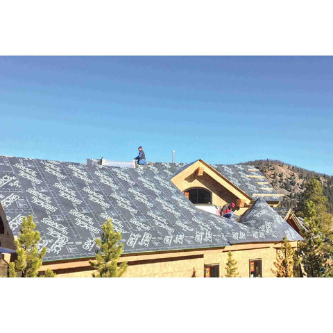 Rock Solid Beat The Heat Ice And Water Shield Roofing Underlayment Self Adhering Rubberized Asphalt installed on sloped roof during construction.