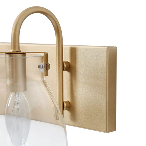 Detail of 3 Light Modern Vanity Light Fixture in Brass Finish With Clear Glass Shades For Bathroom, wall mount.