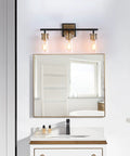Black And Gold Modern Farmhouse Vanity Light With Copper Accent Socket And Back Plate Three Clear Glass Shades 19.7 Inch Bar Easy Install Bathroom Lighting That Elevates Your Space To A Killer Vibe in a bathroom setting