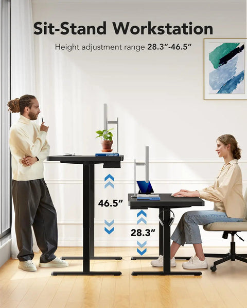 Two people using Electric Standing Desk 71 By 30 Inch Built To Be A Workhorse With Quiet Brushless Motor Height Adjustment Four Memory Presets Sit Stand Home Office Computer Desk With Thick T Shaped Frame in standing and sitting positions.