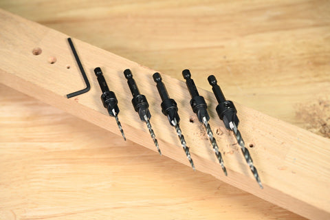 Killer 5 Piece Countersink Set For Screw Sizes 4 Through 12 Adjustable Four Cutter Drill Bit arranged on wood with hex key spacer
