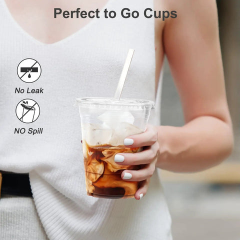 Person holding 100 Pack 16 Oz Clear Plastic Cups With Lids And Straws, Sturdy Food Safe Disposable Cups For Iced Coffee, Smoothies And Cold Drinks