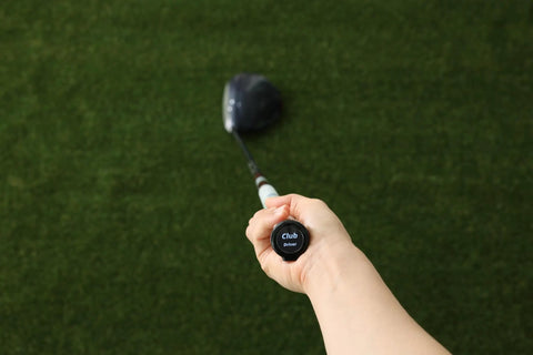 Person holding a golf club with Swing View AI Golf Swing Trainer With OLED Display Real Time Swing And Impact Feedback attached.