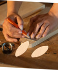 Hands preparing wood with 100Pcs Wood Joining Biscuits Set For Rock Solid Furniture Joints Hardwood Joiner Accessories in workshop.