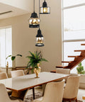 Three Light Modern Glass Pendant Chandelier with Amber Glass Shades hanging over dining table in modern room
