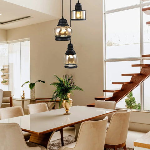 Three Light Modern Glass Pendant Chandelier with Amber Glass Shades hanging over dining table in modern room