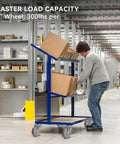 Warehouse worker pushing a blue cart with boxes, fitted with 4 Inch Caster Wheel Set For Cart And Furniture, Three Eighths Inch Bore.