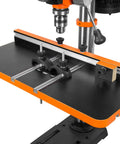 Smooth Rolling Five Speed Benchtop Drill Press Packing A Beefy 2.3 Amp Motor And Sturdy Cast Iron Base showing upgrade table with clamps.