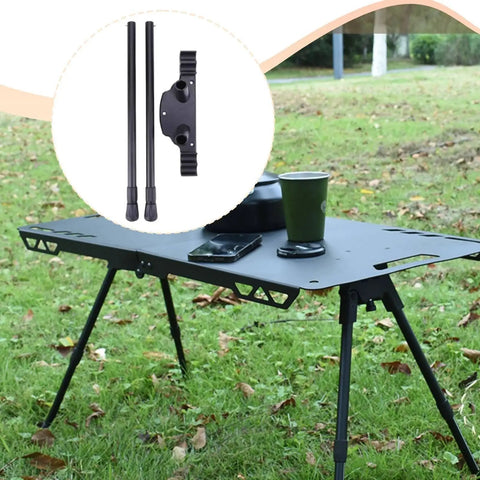 Heavy Duty Folding Table Legs Set displayed on a portable camping table in a grassy outdoor setting.