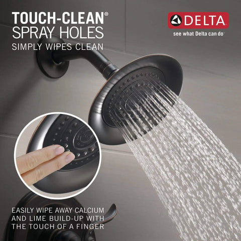 Windemere 14 Series Bathtub And Shower Faucet Set In Oil Rubbed Bronze with Touch-Clean spray holes, water flowing from shower head.