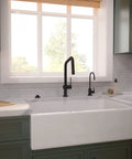 hansgrohe Talis N Pull Down Kitchen Faucet, Modern, Magnetic Hand Sprayer, 1-Handle, 1.75 GPM, Matte Black, 72864671 in kitchen with white sink.