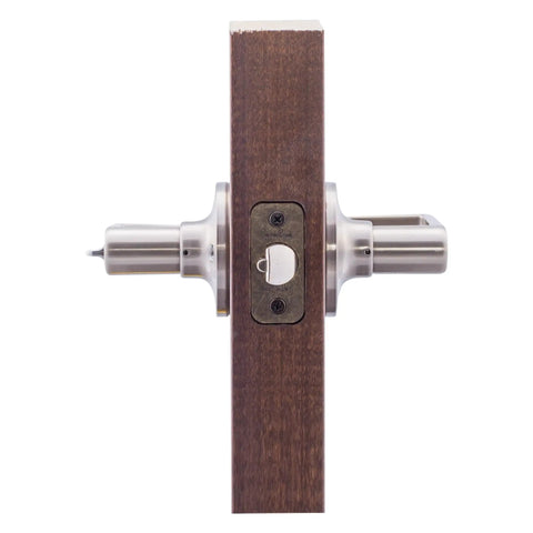 Keyed Entry Lever With Exterior Key And Interior Turn Button In Satin Nickel For Front Door And Home Office, shown on wood panel
