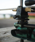 Close-up of Lead Sled DFT 2 Rifle Shooting Rest With Adjustable Ambidextrous Frame in use on a wooden table with rifle and bullets