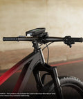 Edge Mountain Bike Mount for Garmin GPS Computers attached to handlebars of a bike in an urban setting, secure fit.
