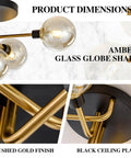 Close-up of amber glass globes and brushed gold finish on Five Light Black And Gold Brushed Metal Sputnik Ceiling Light With Glass Globes Semi Flush Mount Dope Modern Mid Century Chandelier For Farmhouse Vibes And Vintage Style Close To Ceiling Amber.