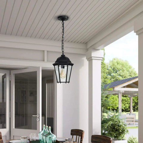 Outdoor Pendant Lights For Porch Black Hanging Lanterns With Adjustable Chain above a patio door.