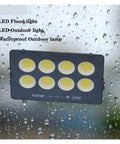 JUDYSSY Ultrathin Led Flood Light 400W shown against rain, highlighting its waterproof design for outdoor use.