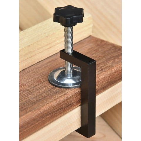 Heavy Duty Adjustable C Clamps Pack Of 8 Aluminum Alloy With Nonslip Rubber Pads For Woodworking Welding Secure Holding And Cabinet Door Alignment Perfection close-up view of a C clamp securing wood with adjustable screw.
