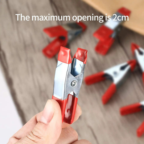 Close-up of a Heavy Duty 2 Inch Metal Spring Clamp with rubber tips showing maximum opening, part of 20-piece set