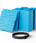 Heavy Duty Rv Leveling Blocks 12 Pack With Velcro Straps interlocking blue pads stacked with strap kit for RV leveling.