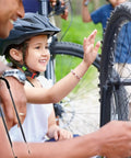 Child learning to ride with Kids Bicycle Safety Trainer Handle For Easy Balance Learning Balance Push Bar held by adult
