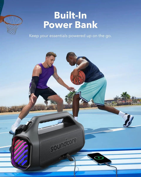 Boom 2 Plus Portable Speaker With 140W BassUp 2.0 beside basketball players charging a phone on a court, power bank feature.