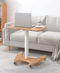 Real Slick Mobile Adjustable Standing Desk With Buttery Smooth Rollaway Casters, Ergonomic Height Adjusting Computer Cart next to couch.