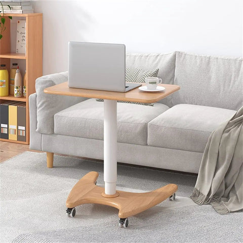 Real Slick Mobile Adjustable Standing Desk With Buttery Smooth Rollaway Casters, Ergonomic Height Adjusting Computer Cart next to couch.