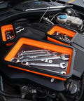 Collapsible Magnetic Parts Organizer Trays with wrenches on car engine