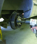 Using the Wheel Stud Installer Tool For Cars And Light Trucks Quick Lug Nut Style Stud Puller with an impact wrench on a car hub