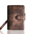 Front view of Must Have Women's Small Bifold Leather Wallet With RFID Blocking And Wristlet Strap, Brown color with strap visible.